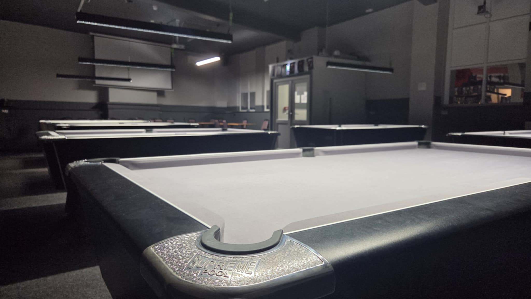 Main bar at Wisbech EX Services Club with trophy shelf and full spirits selection