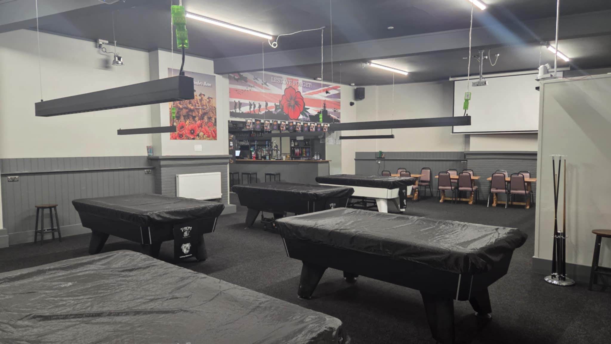 Games room at Wisbech EX Services with dartboards and big screen TV